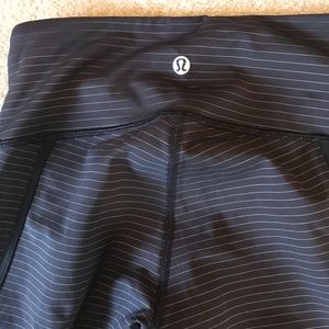 Black lululemon mesh crops with gold stripes
